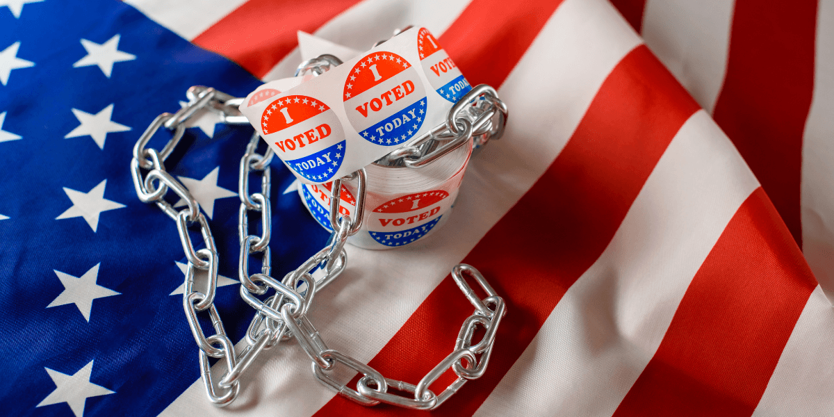 Voting stickers are wrapped in a chain on an American flag background