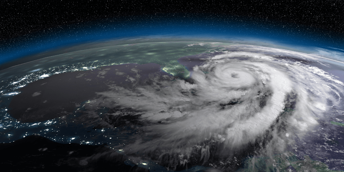 Satellite view of a powerful hurricane swirling over the Gulf of Mexico at night