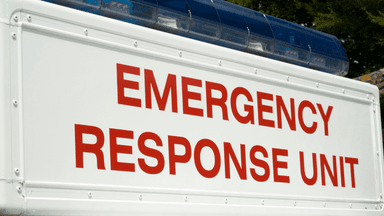 Emergency response vehicle with "Emergency Response Unit" displayed on its side.