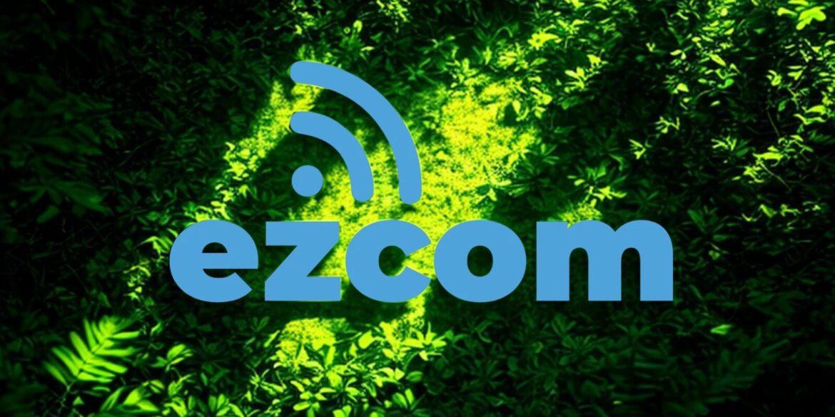 Blue text “ezcom” with a wireless symbol above it is centered over a background of vibrant green foliage. The image conveys a sense of technology and nature.